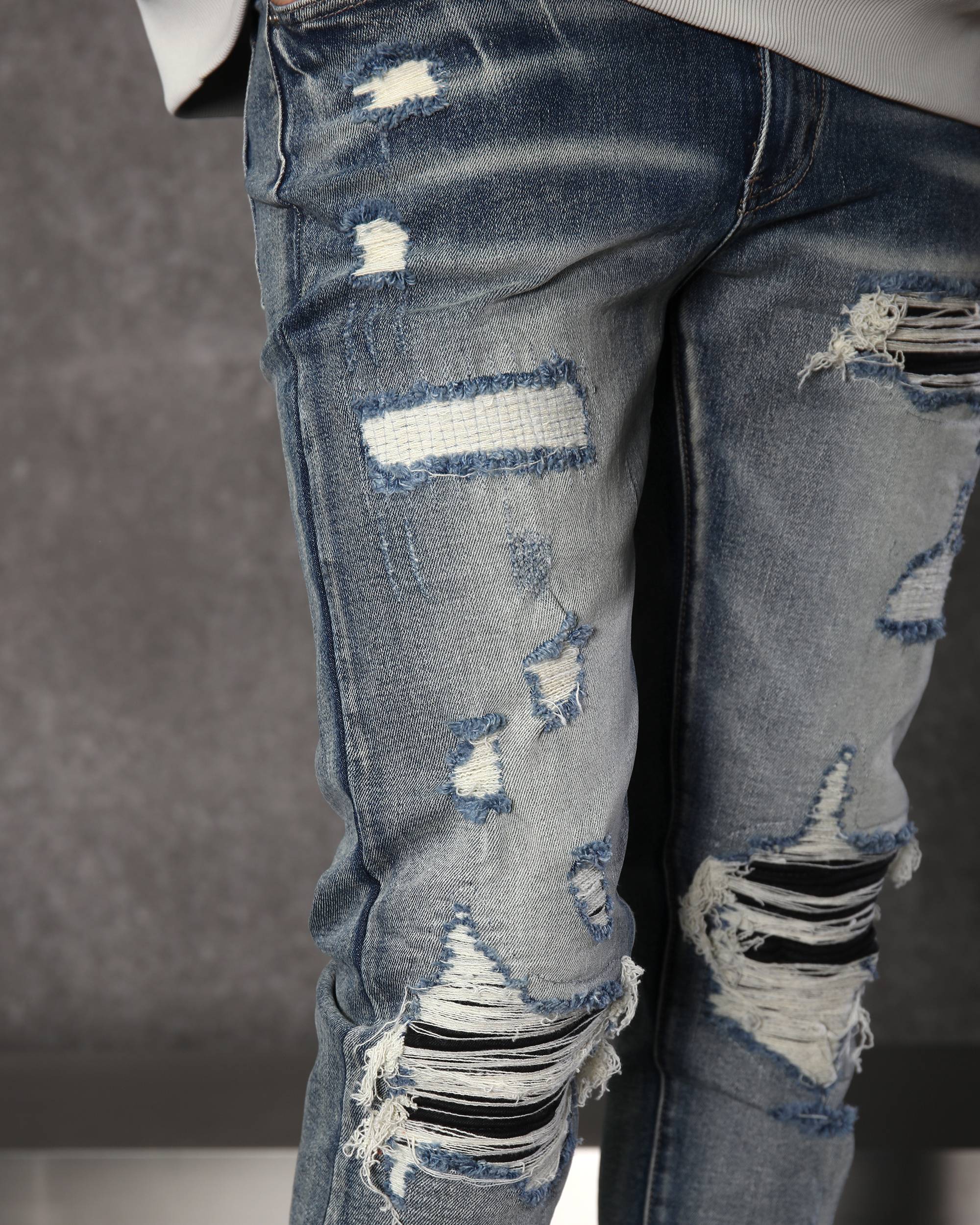 Men’s Streetwear Blue Ripped & Distressed Jeans with Black Patches