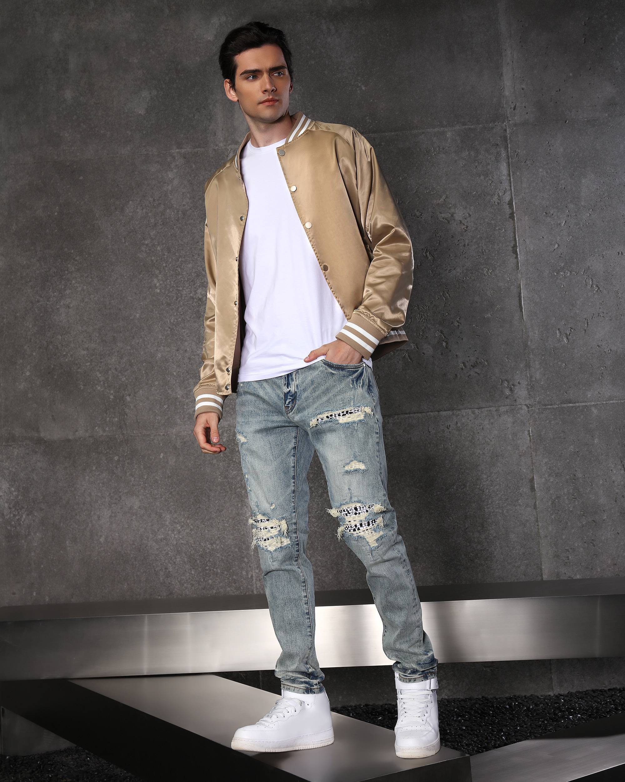 Unique Men’s Light Blue Ripped Jeans with Checkered Patches