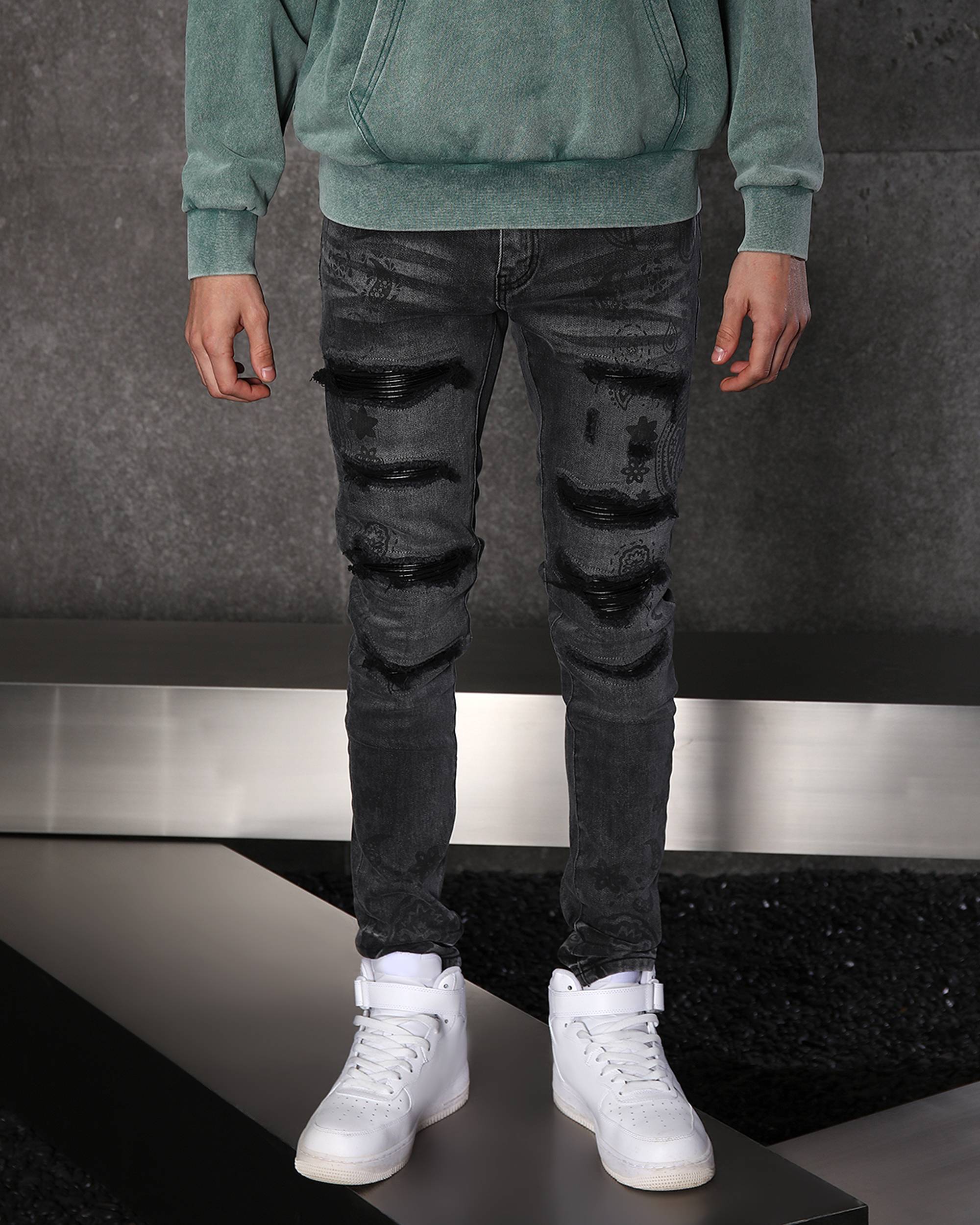 Sleek Men’s Black Distressed Skinny Jeans with Floral Prints